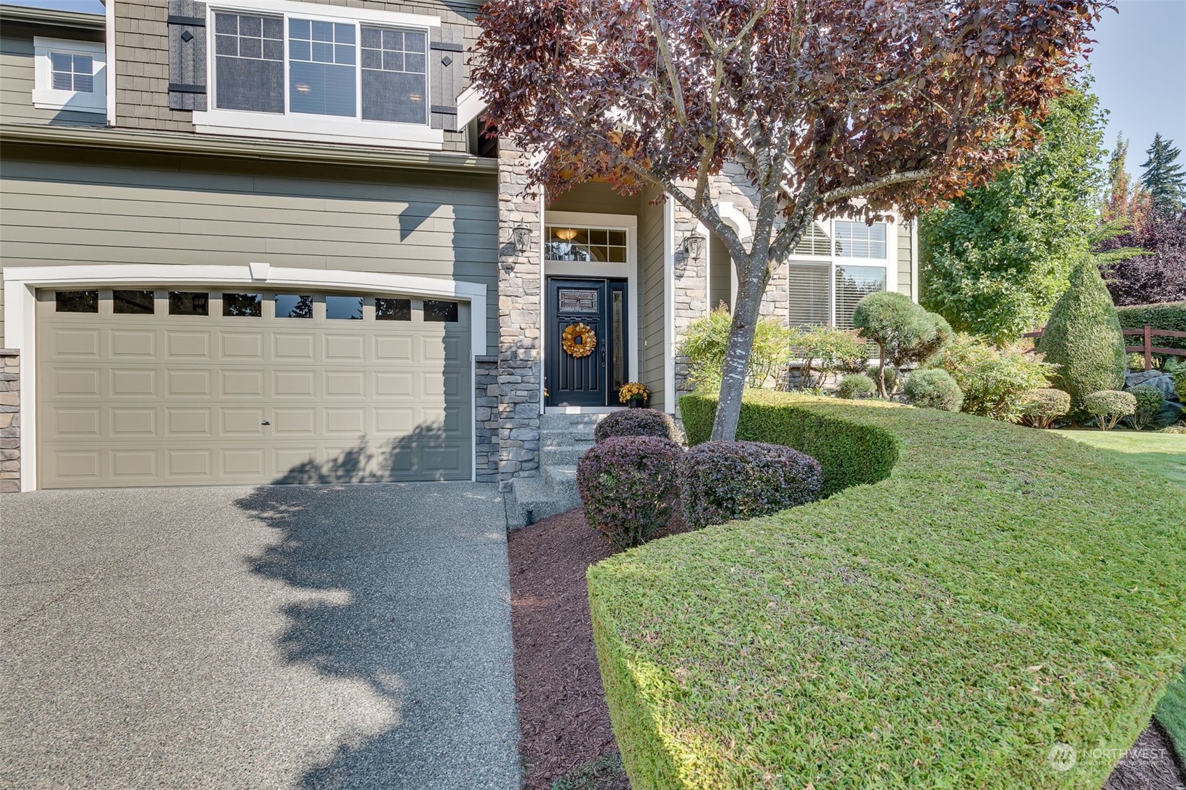 3119 223rd Street Southeast Bothell, WA 98021 - Photo 2 of 40 a front view of a house with a garden