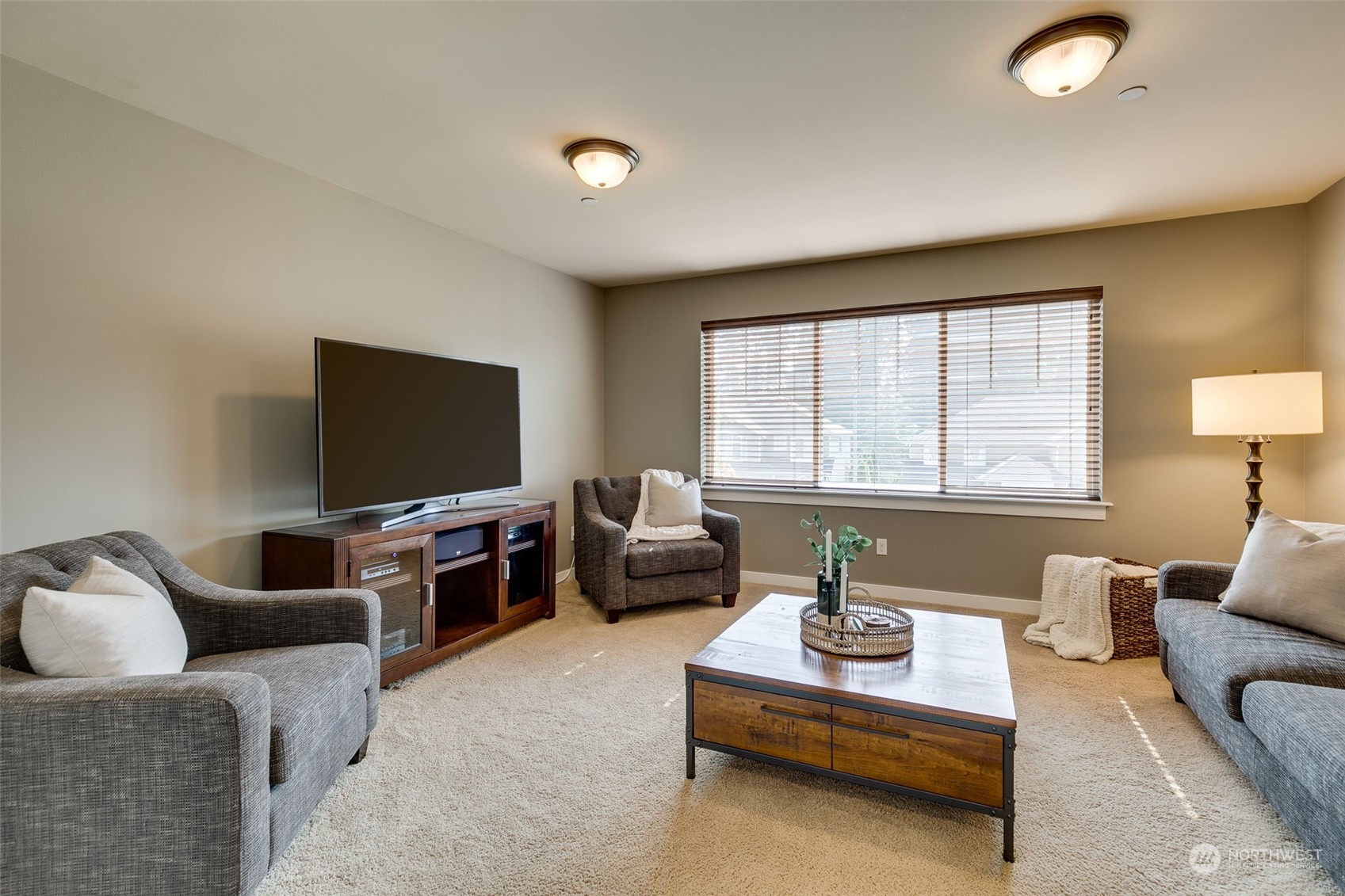3119 223rd Street Southeast Bothell, WA 98021 - Photo 21 of 40 a living room with furniture and a flat screen tv