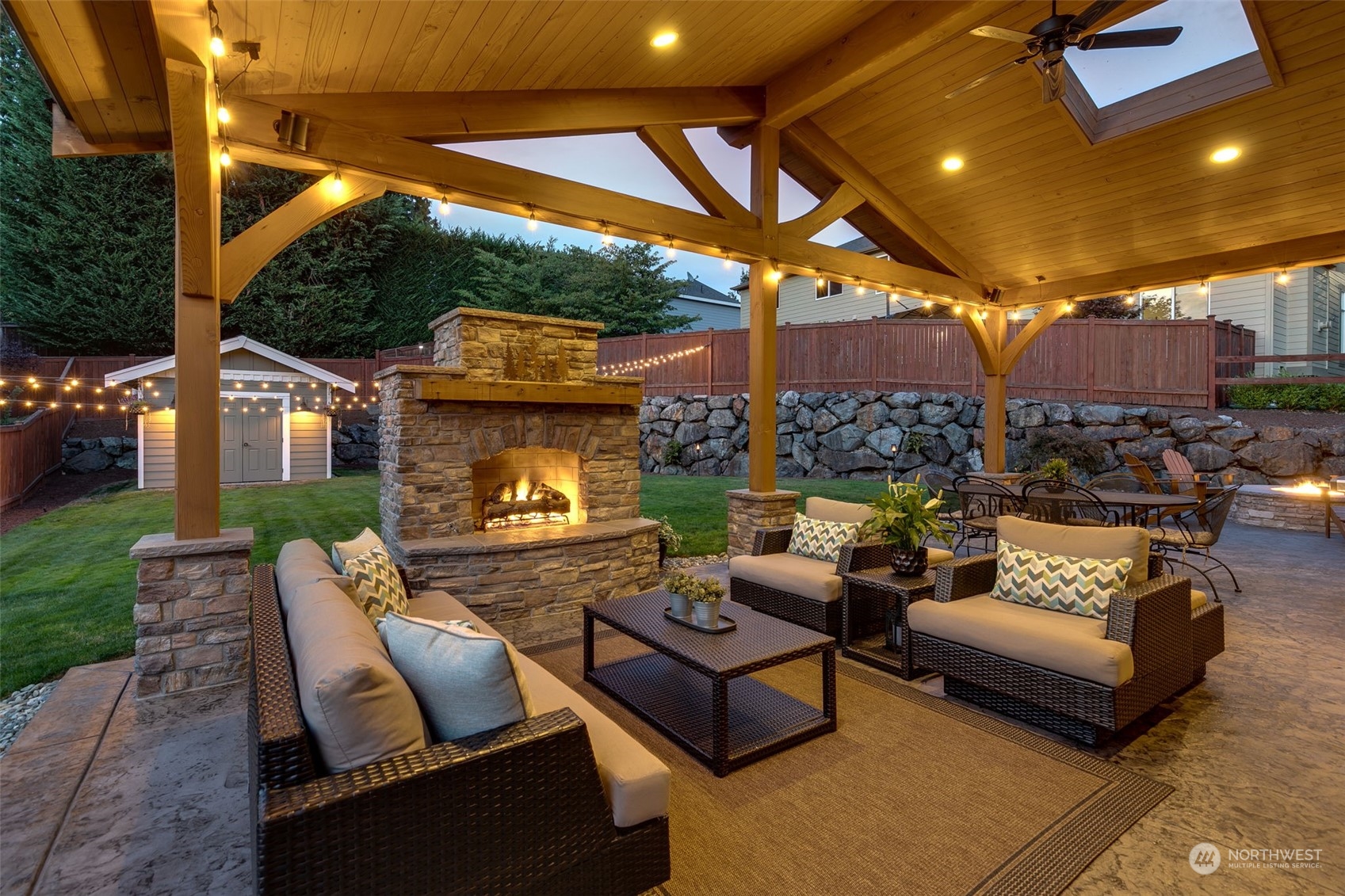 3119 223rd Street Southeast Bothell, WA 98021 - Photo 35 of 40 a outdoor living space with patio furniture and a fireplace