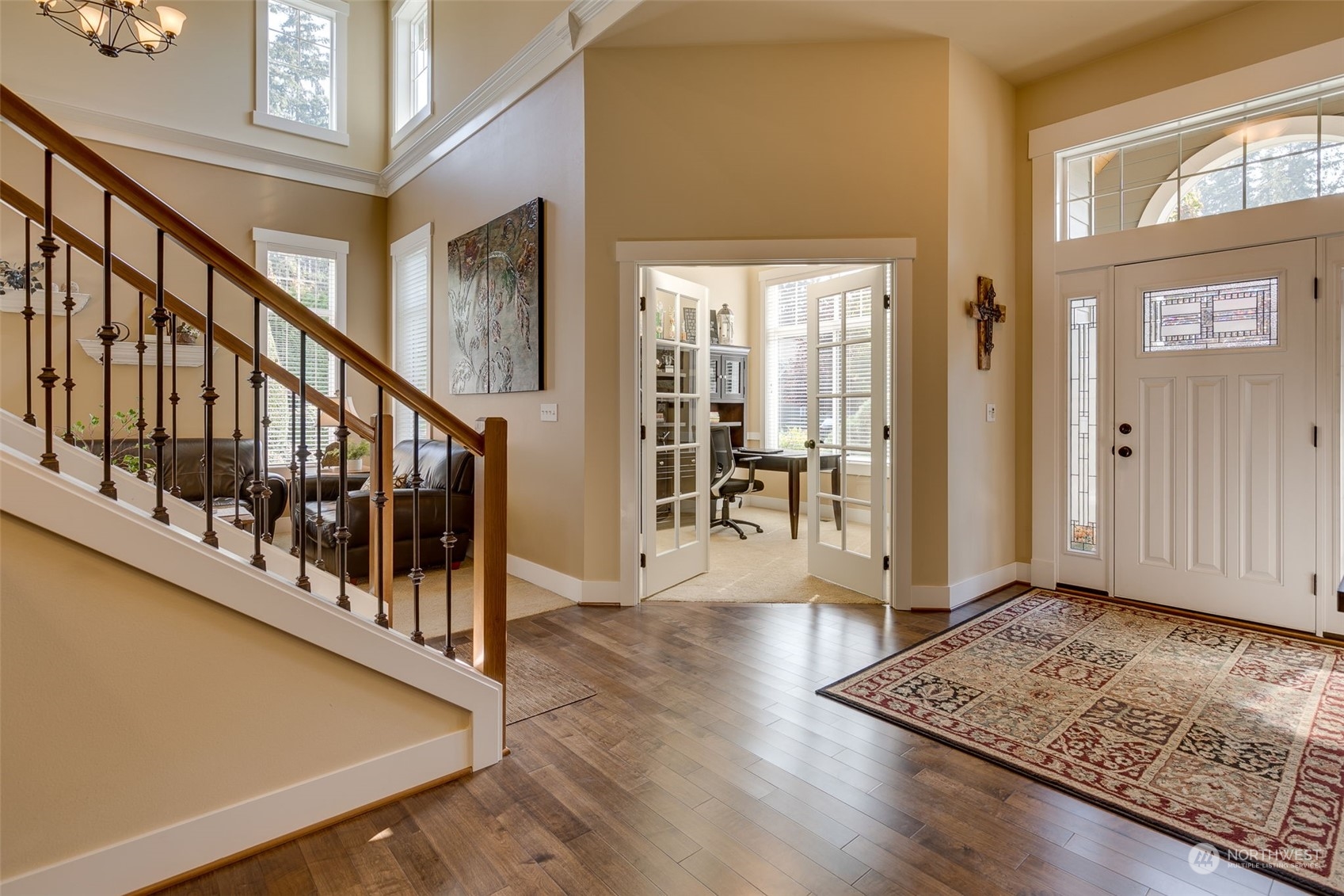3119 223rd Street Southeast Bothell, WA 98021 - Photo 7 of 40 a view of an entryway with wooden floor and windows