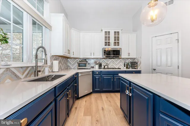 a bedroom with furniture and a potted plant