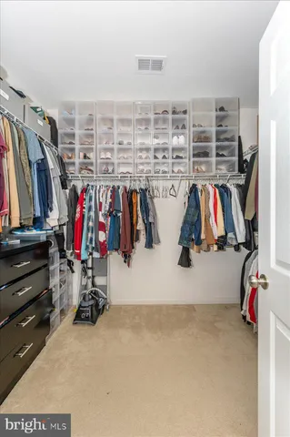 a spacious bathroom with a granite countertop tub sink and mirror