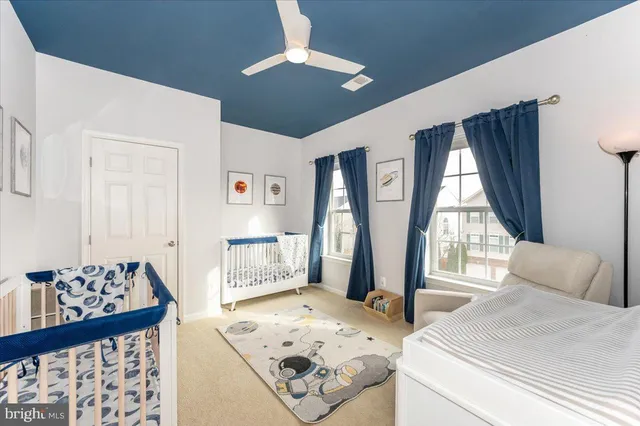 a view of a livingroom with furniture and windows