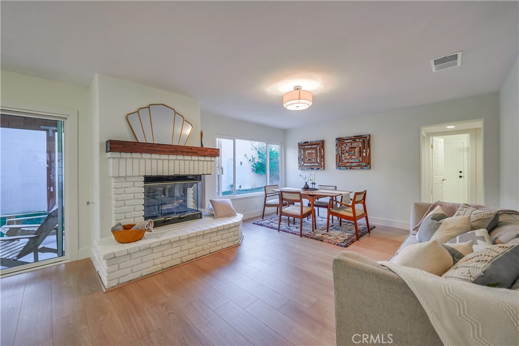 1626 Turquoise Drive Corona, CA 92882 - Photo 13 of 60 a living room with furniture and a fireplace