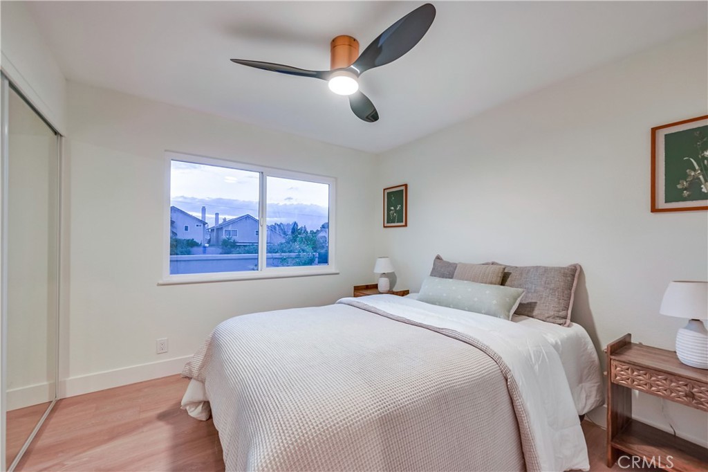 1626 Turquoise Drive Corona, CA 92882 - Photo 44 of 60 a bedroom with a large bed and a window