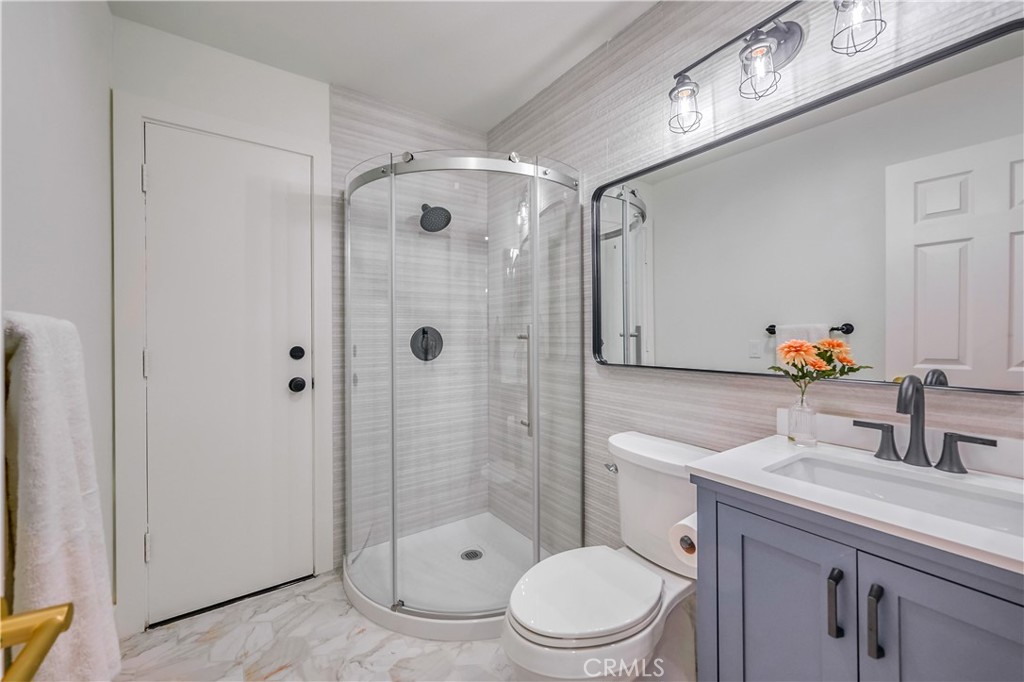 1626 Turquoise Drive Corona, CA 92882 - Photo 48 of 60 a bathroom with a sink a toilet and shower