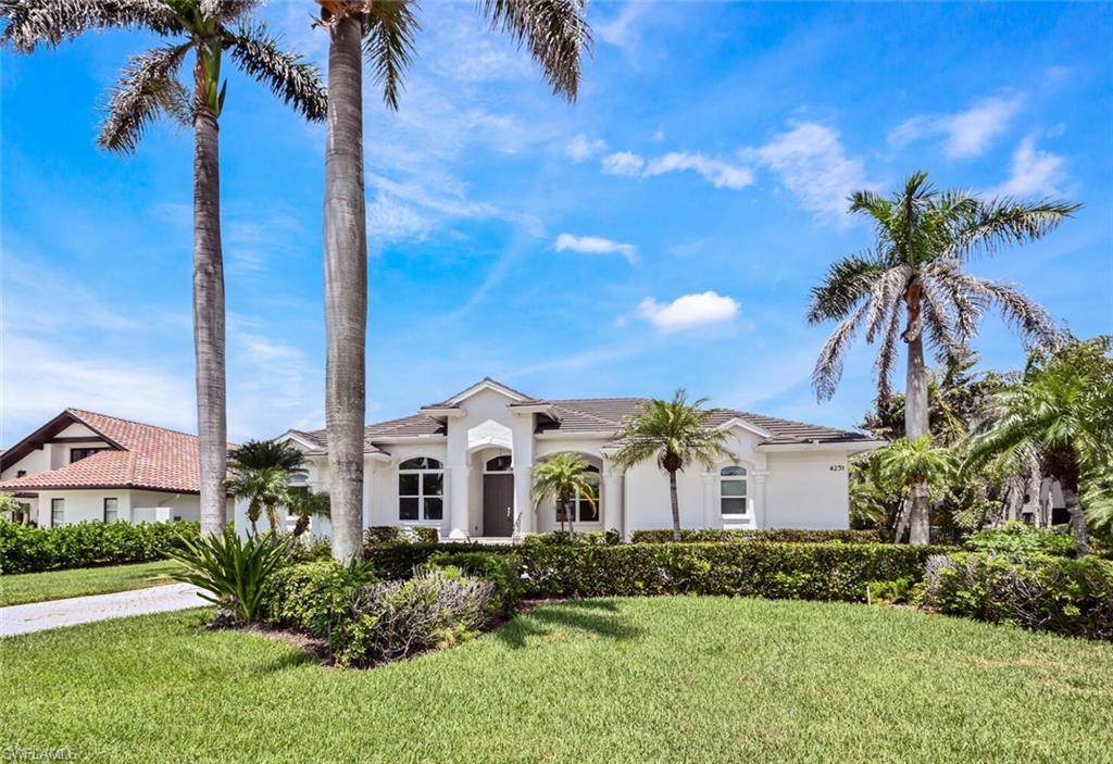 4231 Crayton Road Naples, FL 34103 - Photo 1 of 46 a view of a house with a yard and potted plants