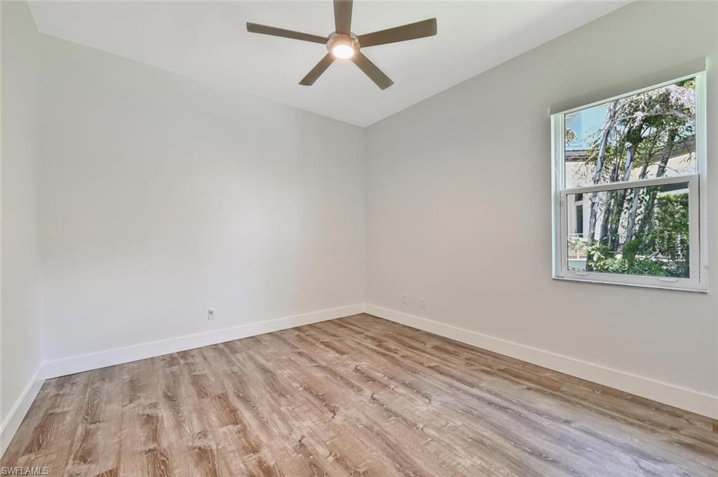 4231 Crayton Road Naples, FL 34103 - Photo 31 of 46 an empty room with a window