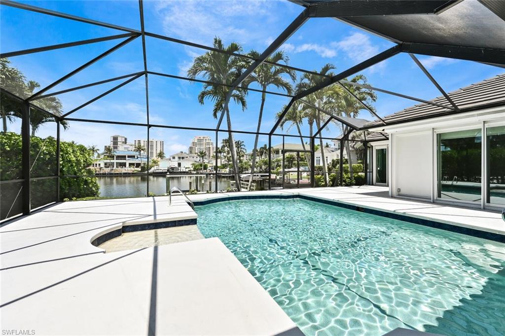 4231 Crayton Road Naples, FL 34103 - Photo 36 of 46 a view of a backyard with sitting area