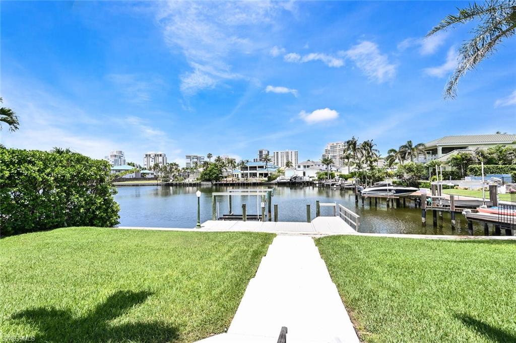 4231 Crayton Road Naples, FL 34103 - Photo 42 of 46 a house view with a lake view