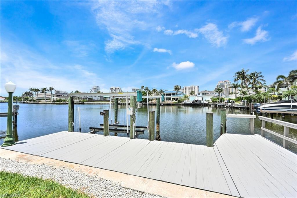 4231 Crayton Road Naples, FL 34103 - Photo 43 of 46 a house view with a lake view