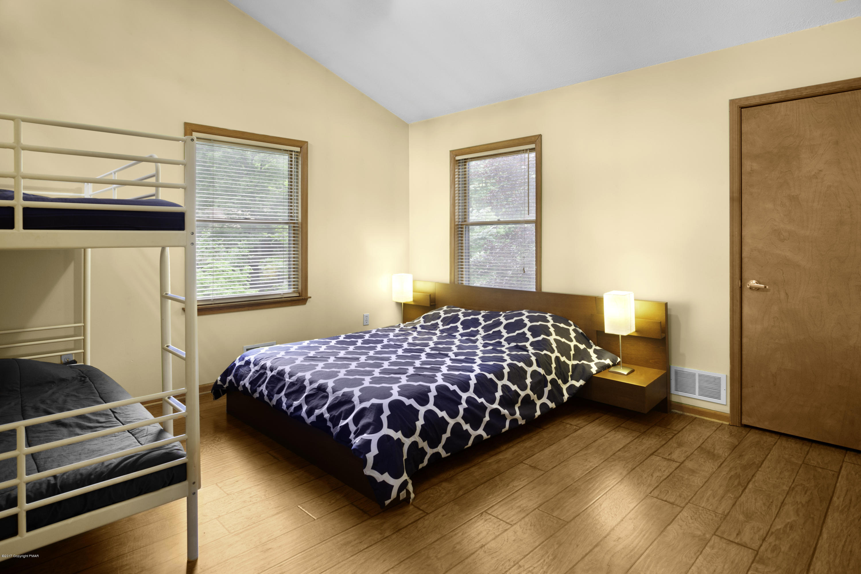 1044 Upper Ridge View Drive East Stroudsburg, PA 18302 - Photo 14 of 27 a bedroom with a bed and wooden floor