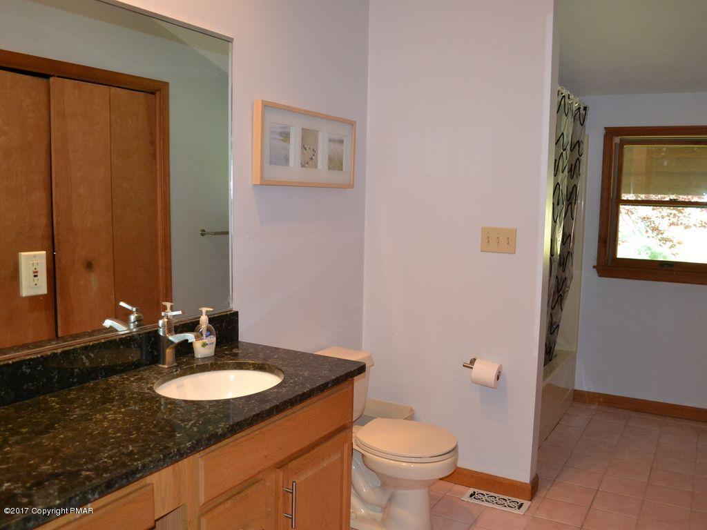 1044 Upper Ridge View Drive East Stroudsburg, PA 18302 - Photo 16 of 27 a bathroom with a granite countertop sink and a mirror