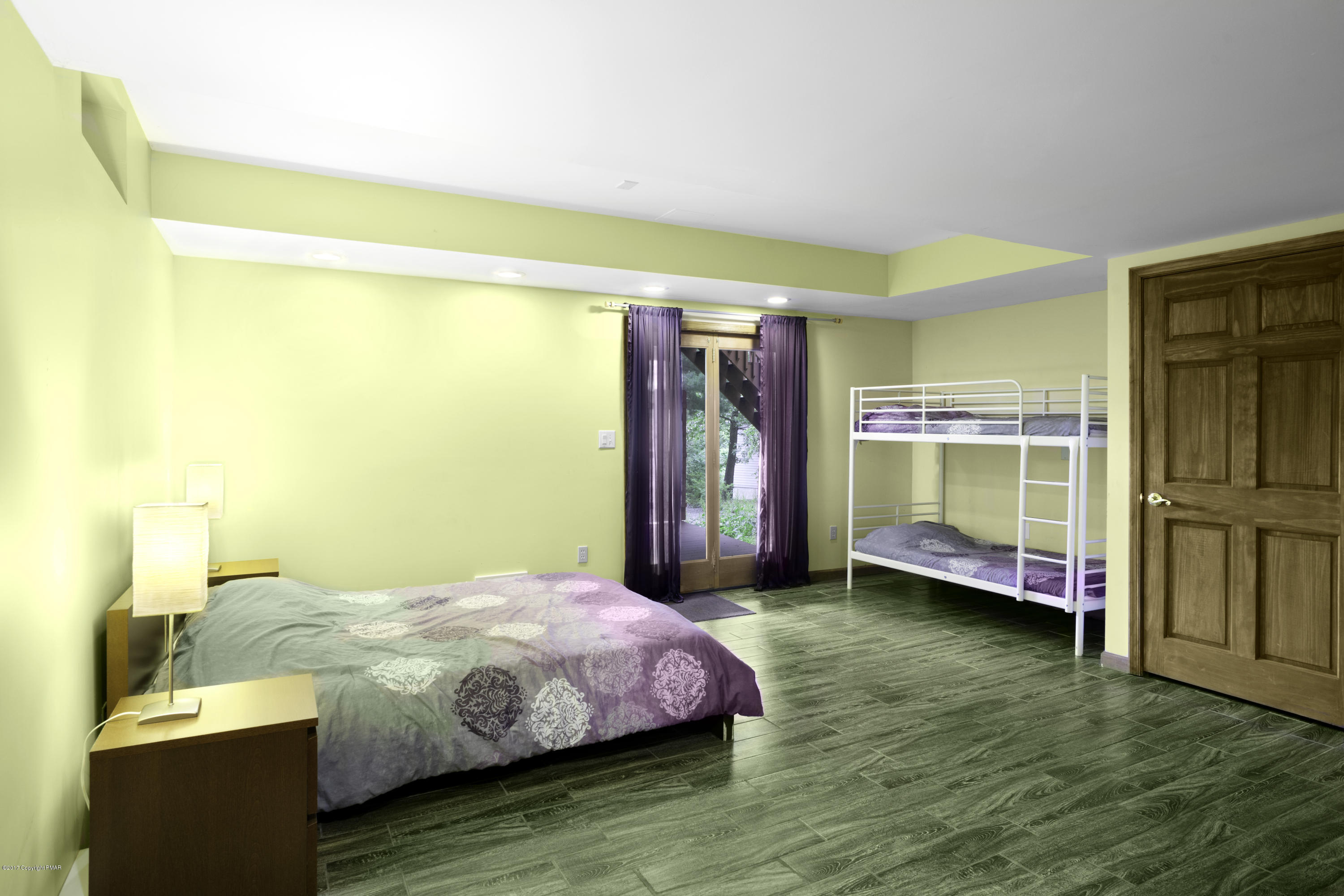 1044 Upper Ridge View Drive East Stroudsburg, PA 18302 - Photo 18 of 27 a bedroom with a bed and wooden floor