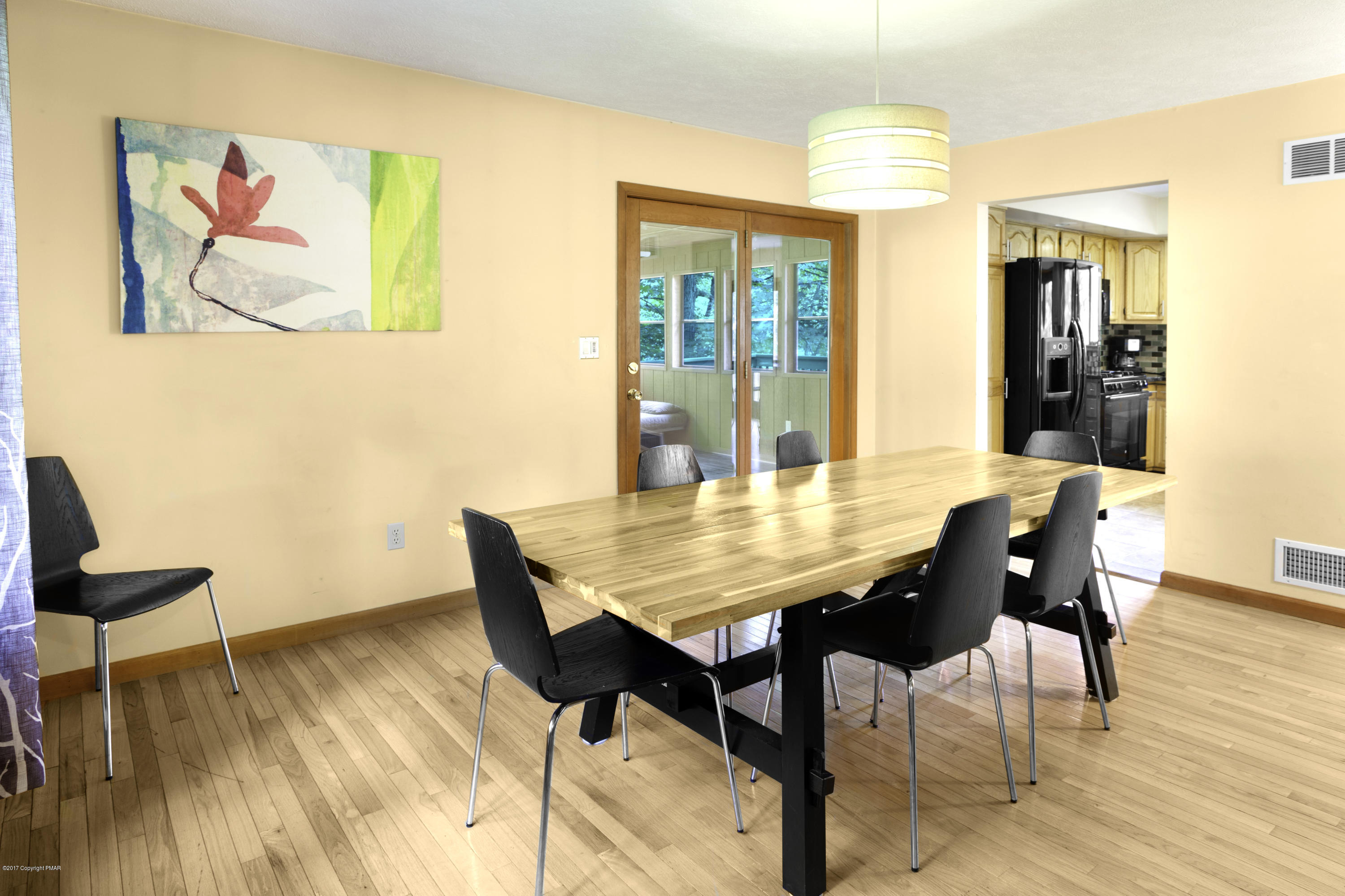 1044 Upper Ridge View Drive East Stroudsburg, PA 18302 - Photo 3 of 27 a view of a dining room with furniture and wooden floor