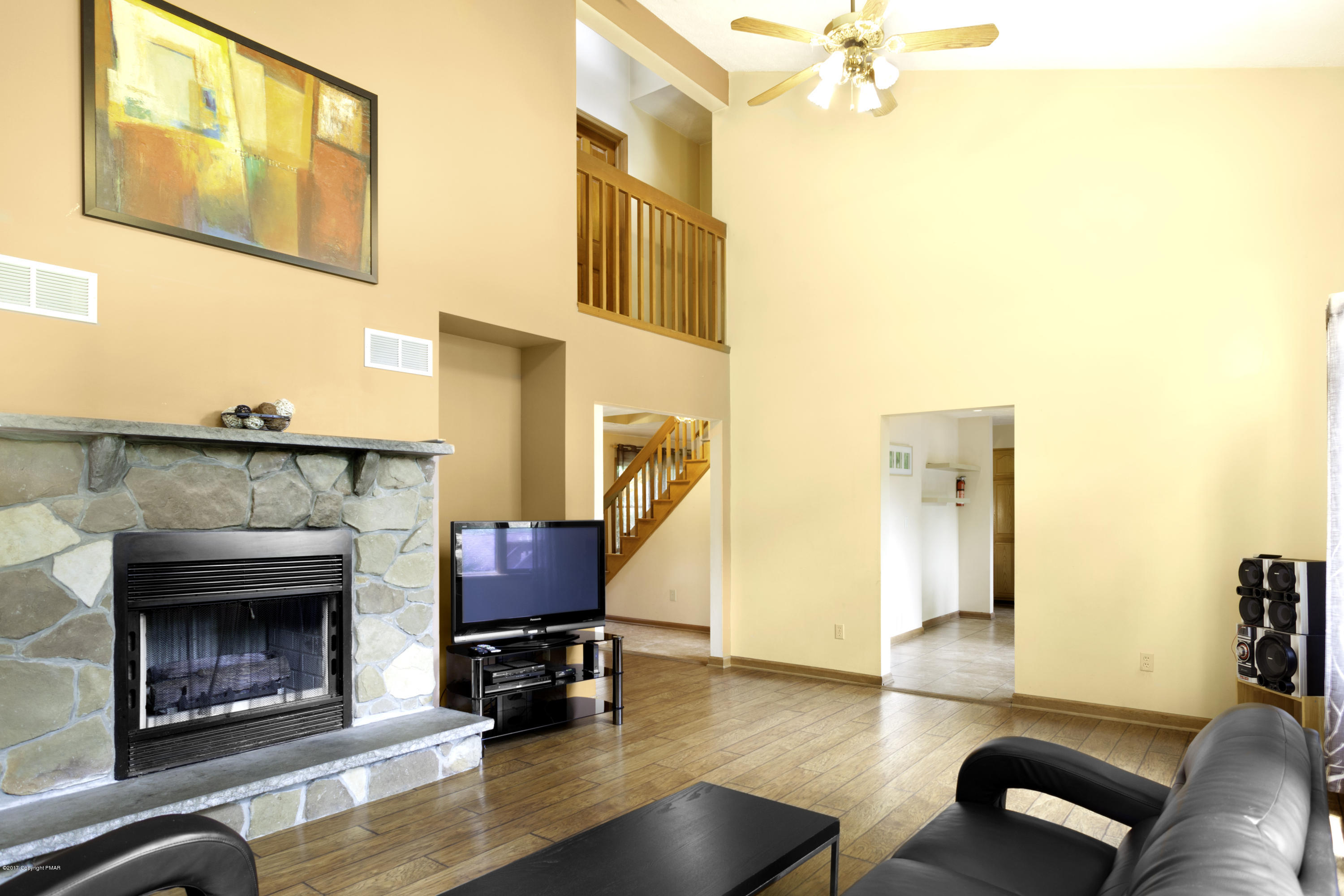 1044 Upper Ridge View Drive East Stroudsburg, PA 18302 - Photo 4 of 27 a living room with furniture and a fireplace