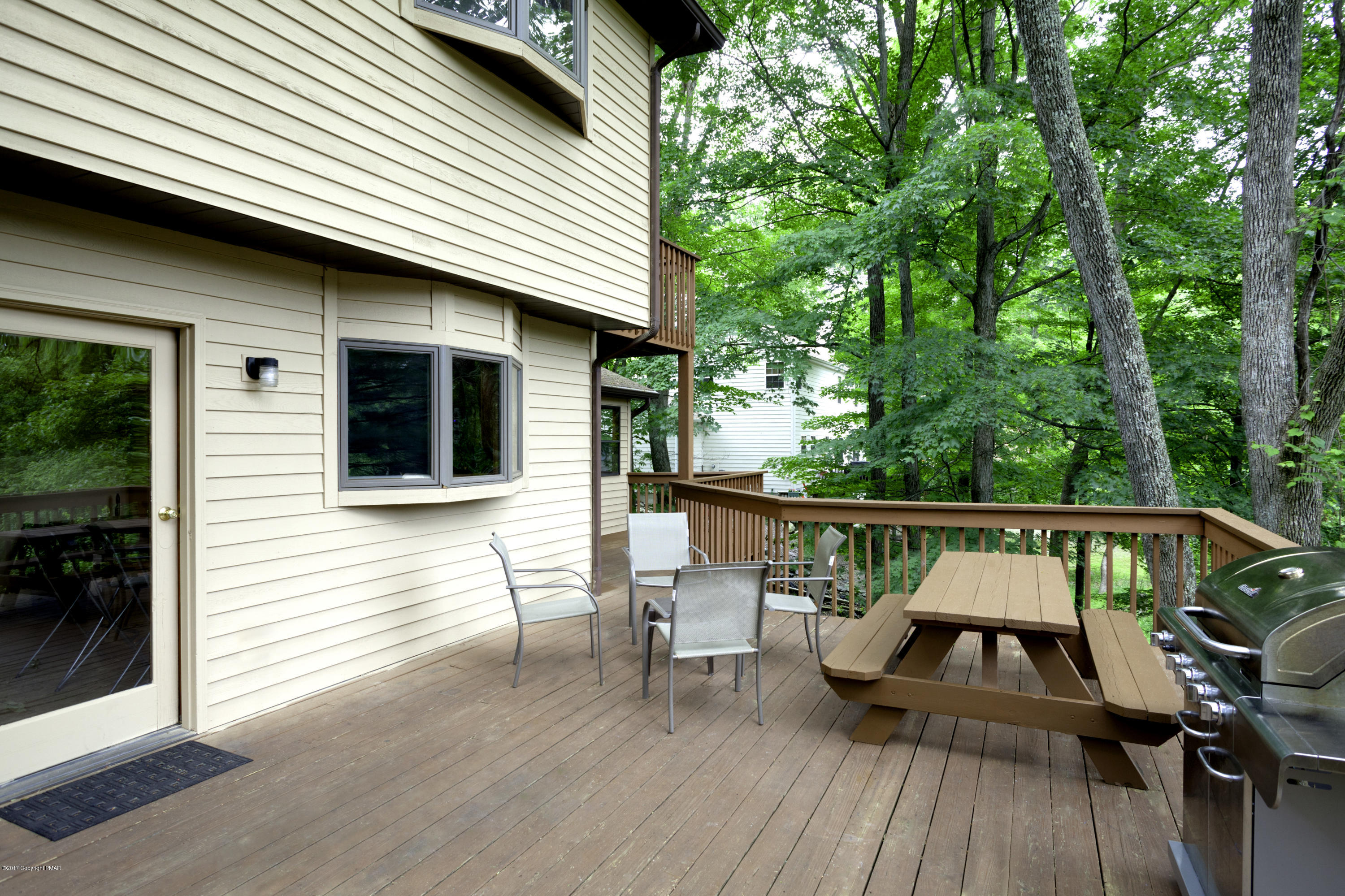 1044 Upper Ridge View Drive East Stroudsburg, PA 18302 - Photo 8 of 27 a view of deck with furniture and trees