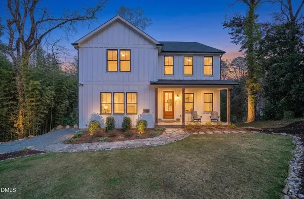 a view of a house with backyard outdoor space and garden