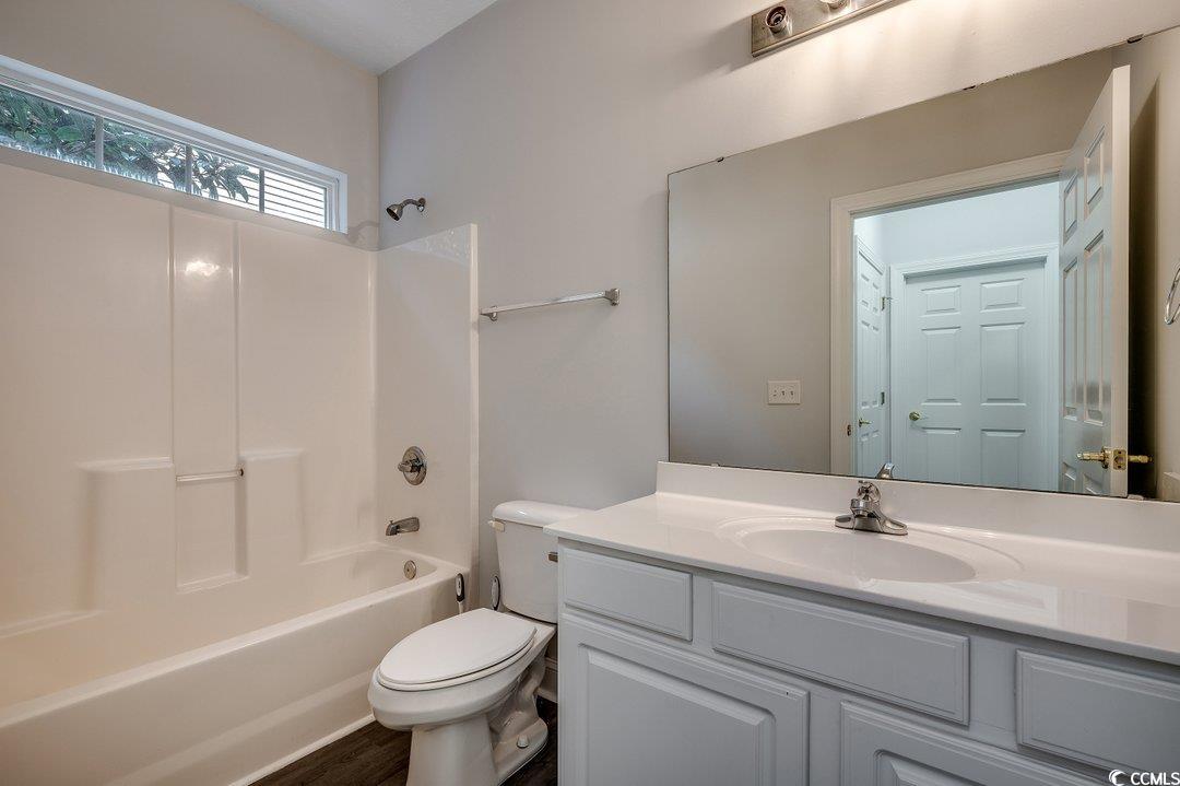 999 Algonquin Drive, Unit E Pawleys Island, SC 29585 - Photo 16 of 37 Full bath with shower / bathtub combination, vanity, and toilet