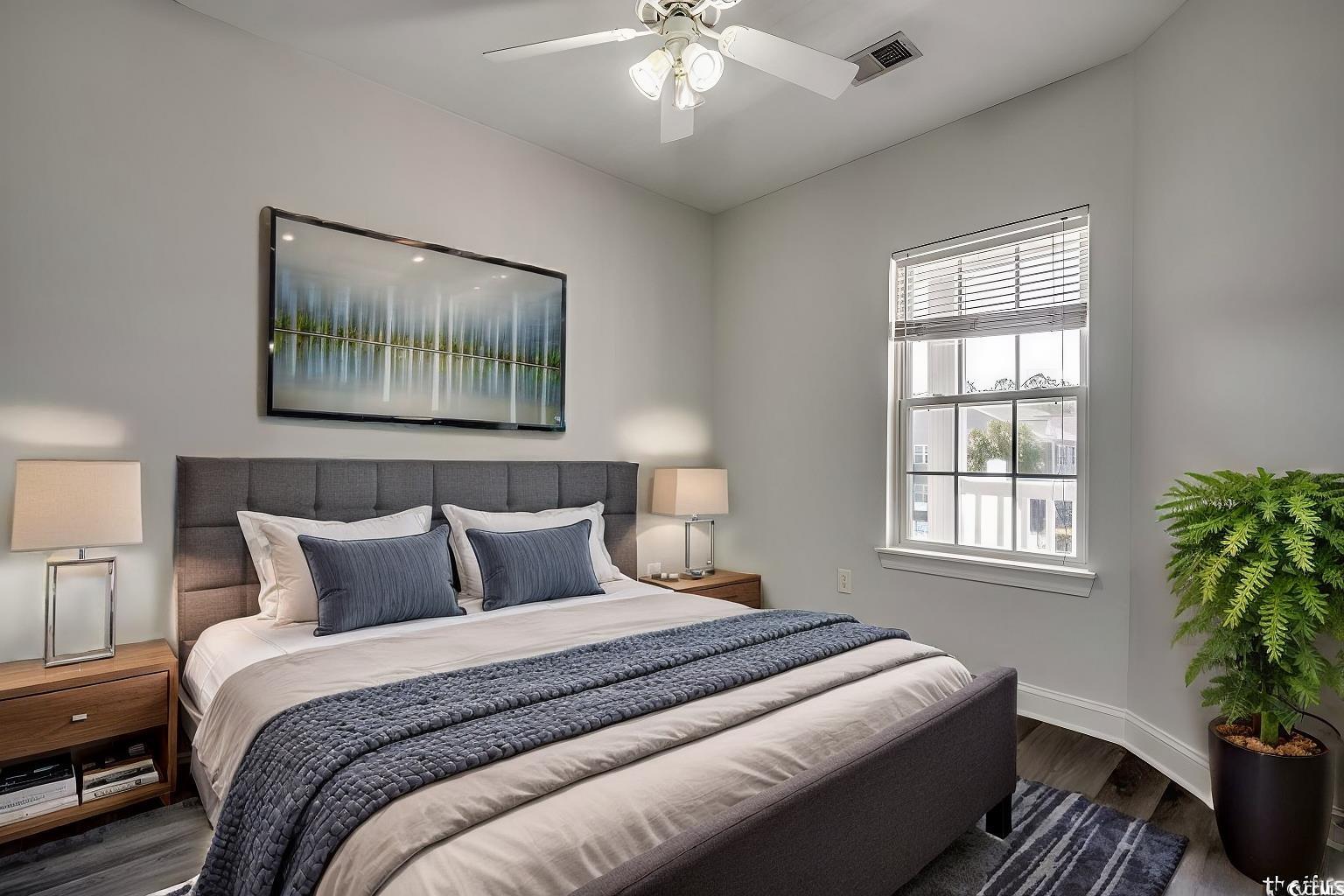 999 Algonquin Drive, Unit E Pawleys Island, SC 29585 - Photo 5 of 37 Bedroom with baseboards, visible vents, wood finished floors, and a ceiling fan