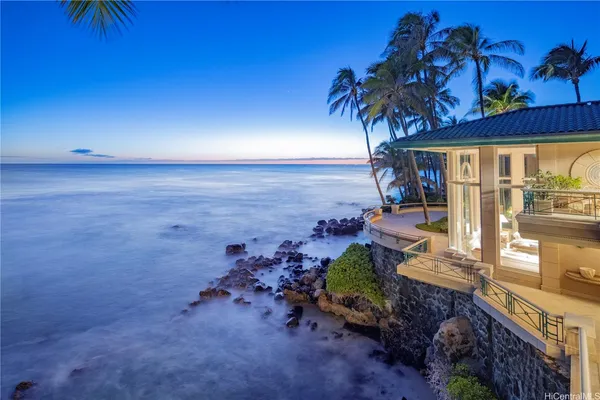 a view of a terrace with a table and chairs