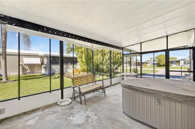 a view of an empty room with sliding glass door