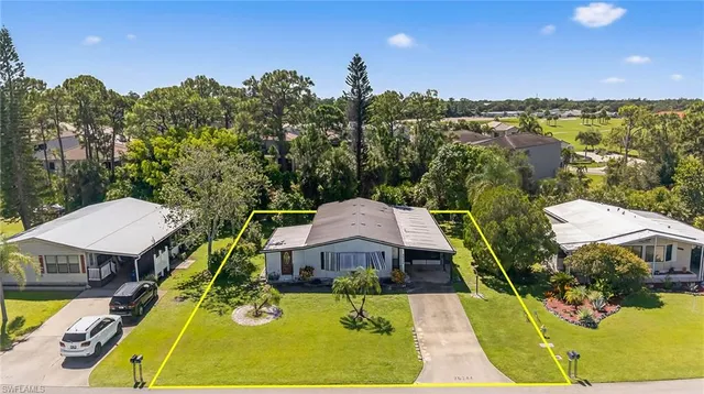 a view of a swimming pool with a patio and a garden