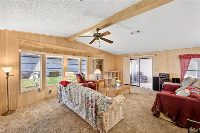 a living room with furniture and windows