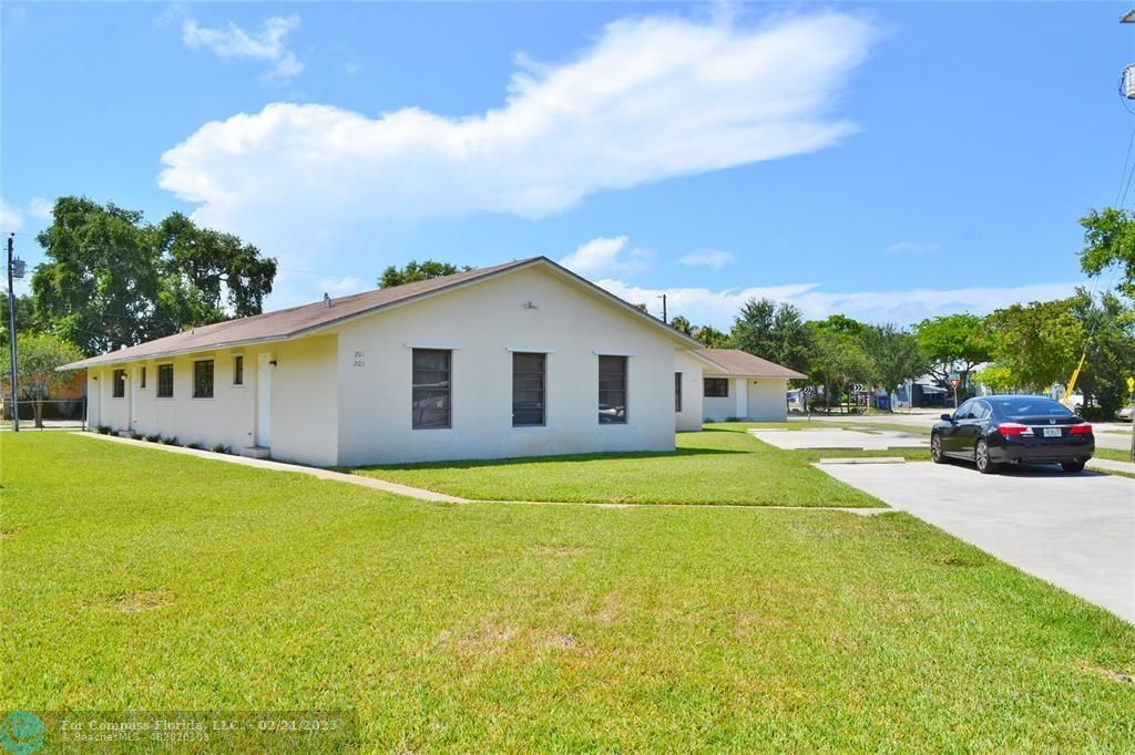 5907 North Tyler Hollywood, FL 33021 - Photo 1 of 33 a house view with swimming pool and wooden fence
