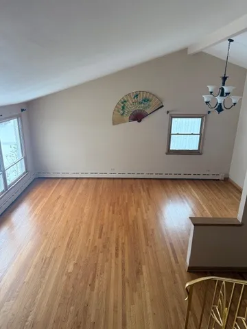 a view of an empty room and a window