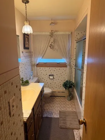 a bathroom with a sink a mirror and a shower