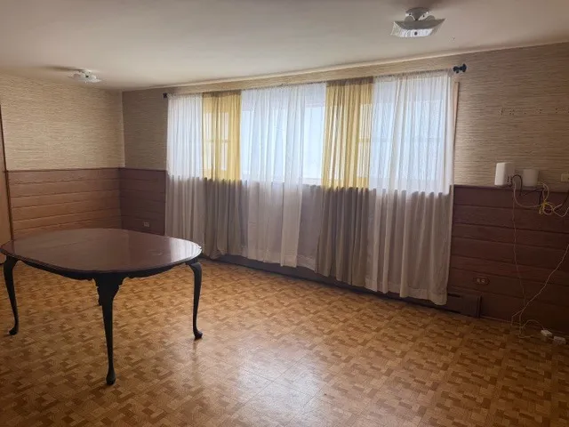 a view of kitchen with furniture and wooden floor