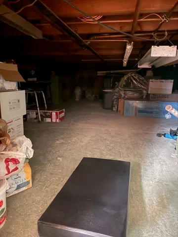 a bedroom with a bed and a large mirror with a flat tv screen