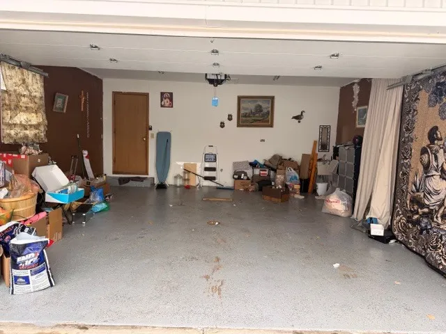 a view of living room with furniture and a window