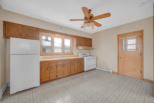 a kitchen with a refrigerator a sink and dishwasher