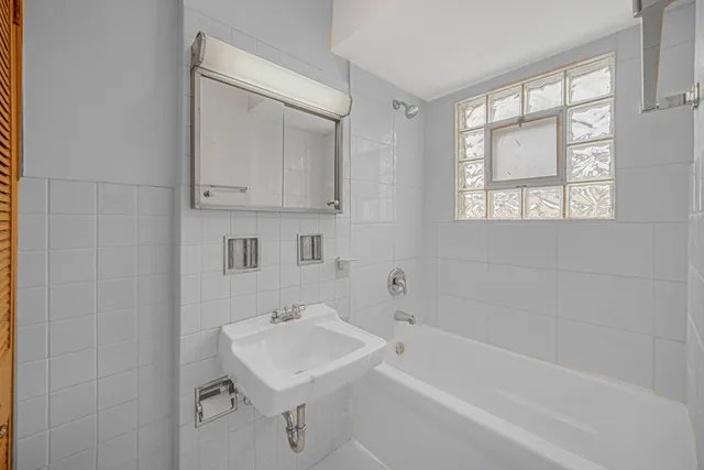 a bathroom with a sink toilet and bathtub