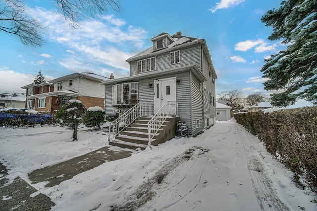 a view of a house with wooden fence
