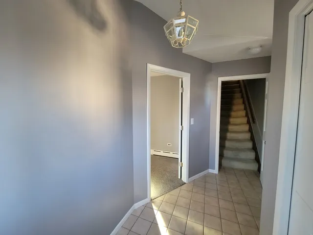 a view of a hallway view with staircase