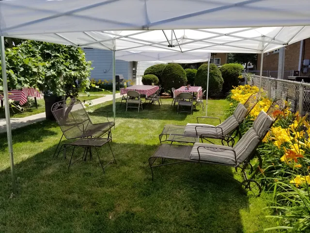 a swimming pool with outdoor seating and yard