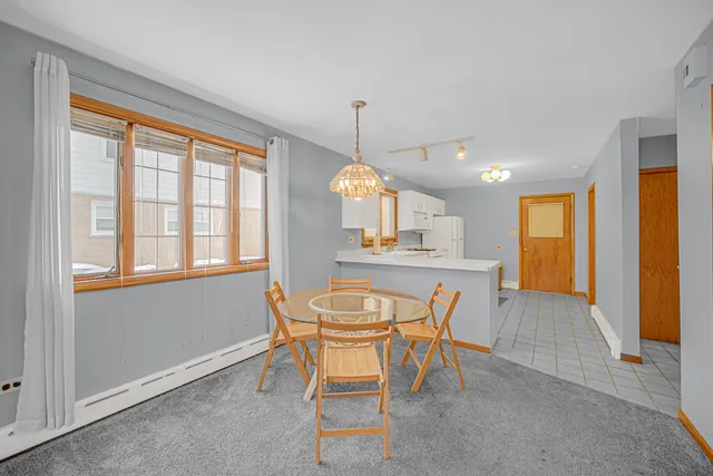 a view of a dining room with furniture window and outside view
