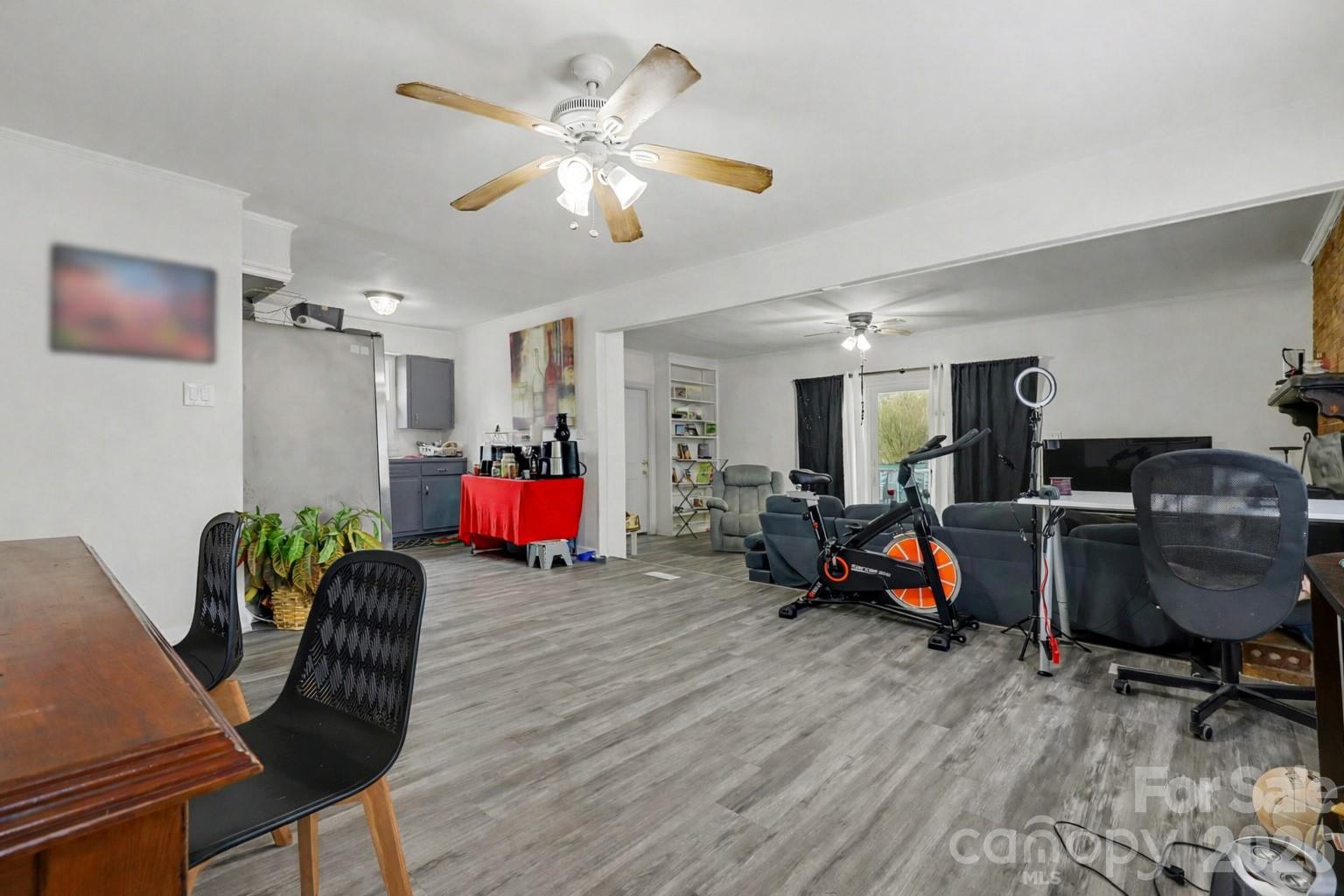 128 Paul Snipes Road Lancaster, SC 29720 - Photo 6 of 29 a living room with furniture and a gym cycle