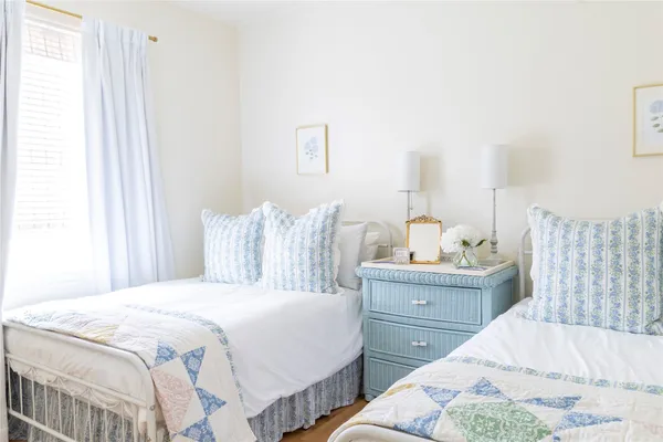 a bedroom with double bed and a window