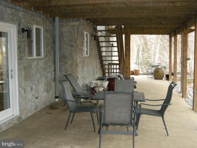 7114 Ivakota Road Clifton, VA 20124 - Photo 14 of 30 Patio Across Entire Back of Home With Deck Above