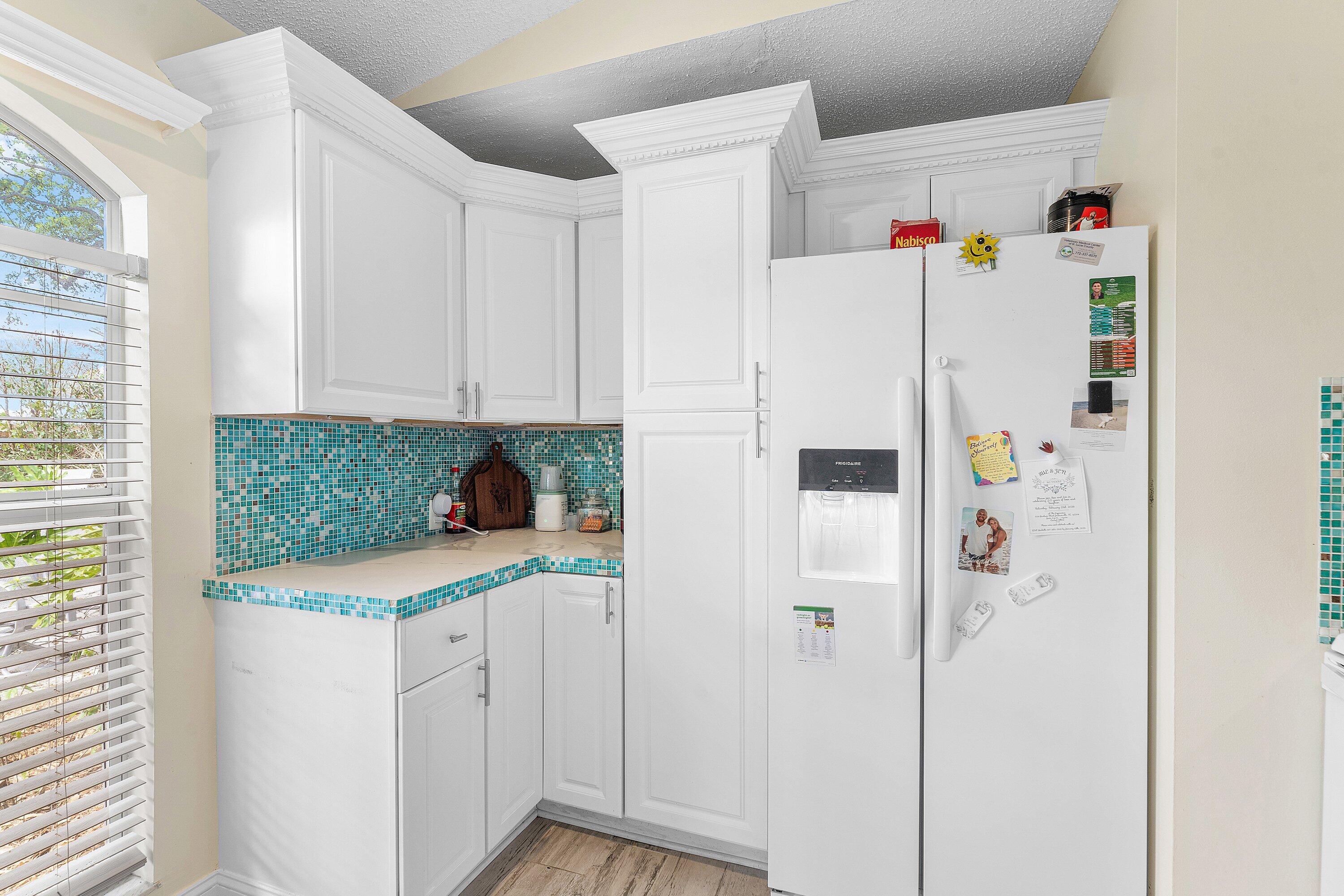 2114 Southeast Midtown Road Port St. Lucie, FL 34952 - Photo 13 of 41 a white cabinet with white cabinets