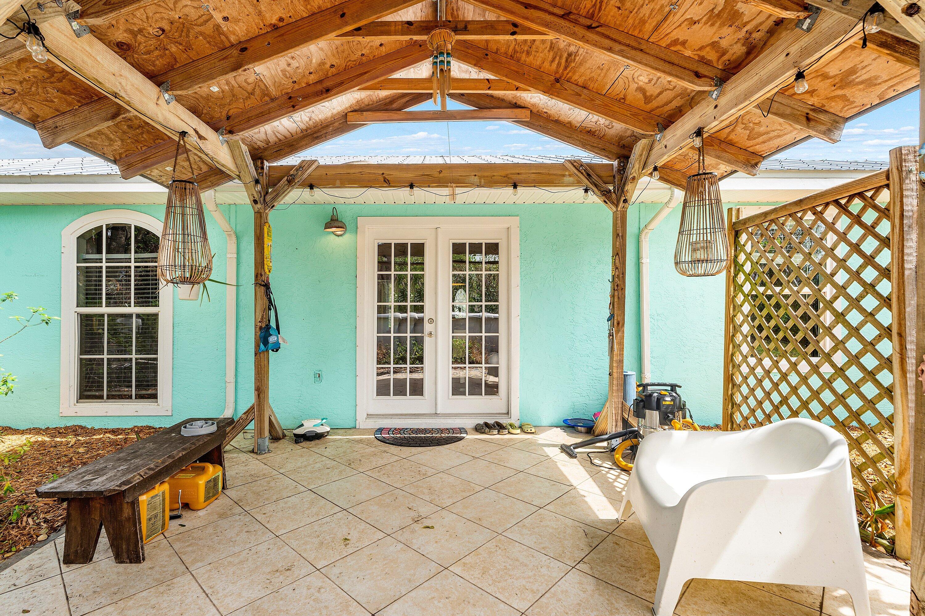2114 Southeast Midtown Road Port St. Lucie, FL 34952 - Photo 22 of 41 a front view of a house with a chairs and table