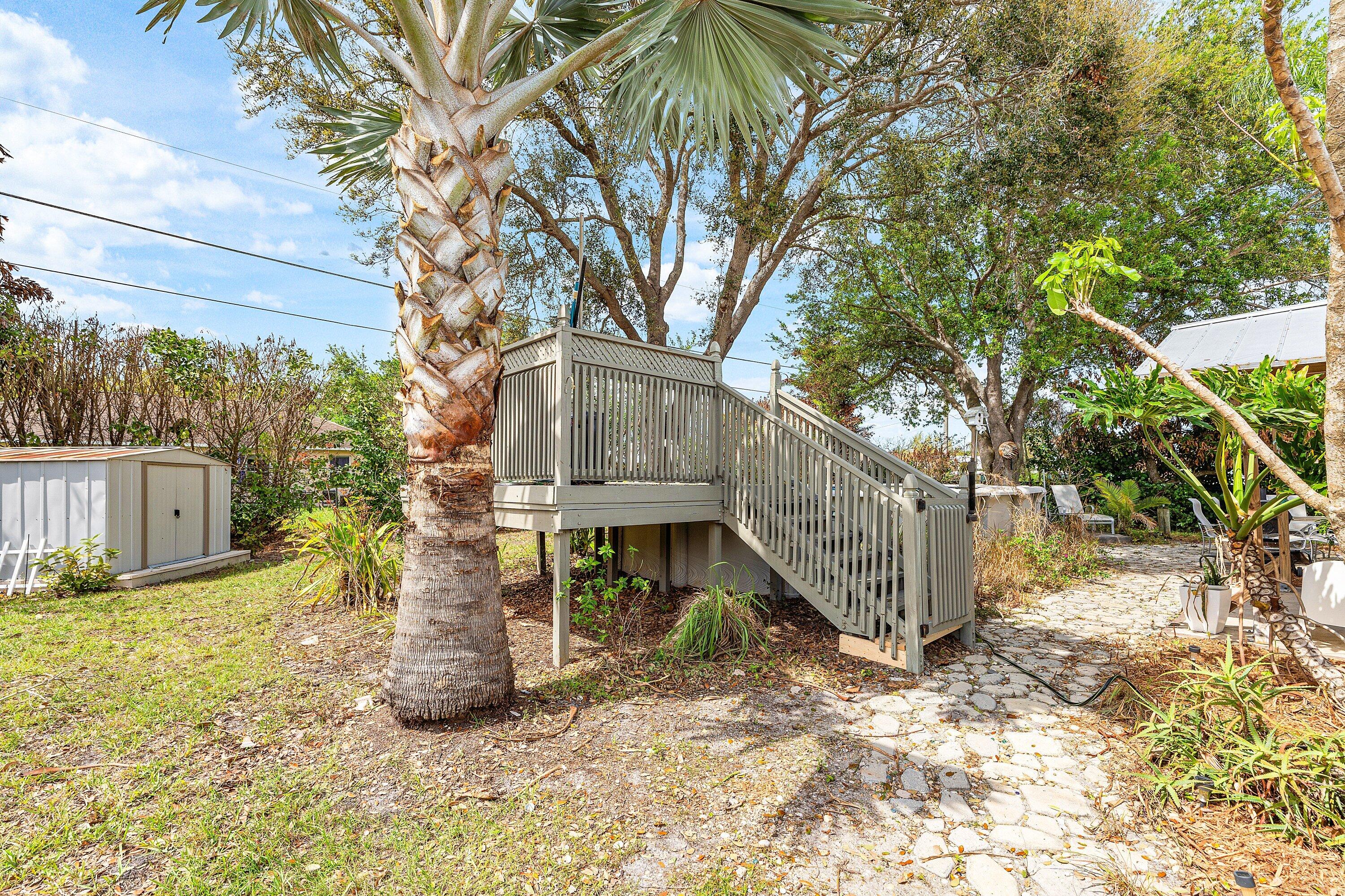 2114 Southeast Midtown Road Port St. Lucie, FL 34952 - Photo 23 of 41 a view of a house with a yard