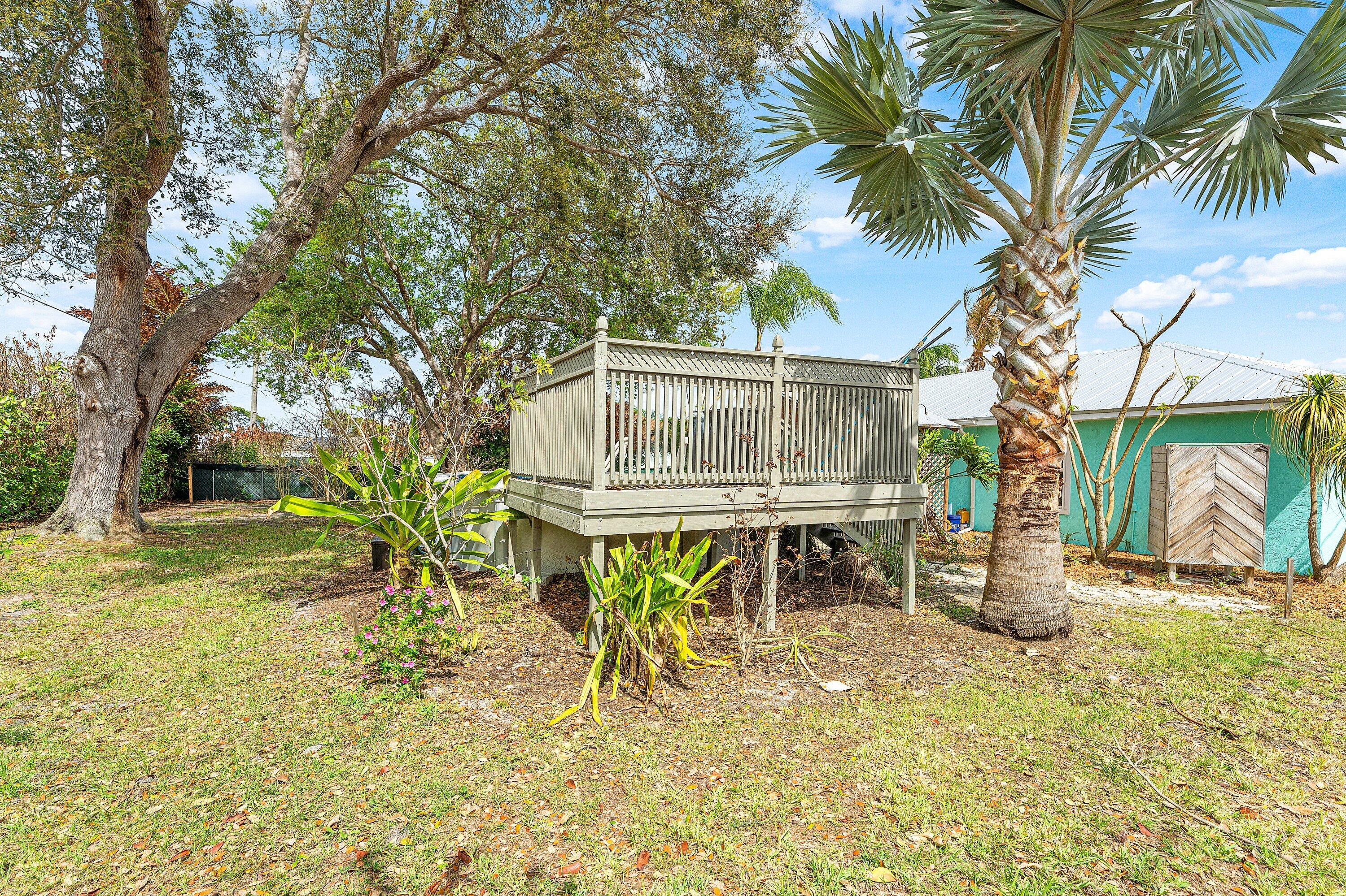 2114 Southeast Midtown Road Port St. Lucie, FL 34952 - Photo 24 of 41 a backyard of a house with table and chairs