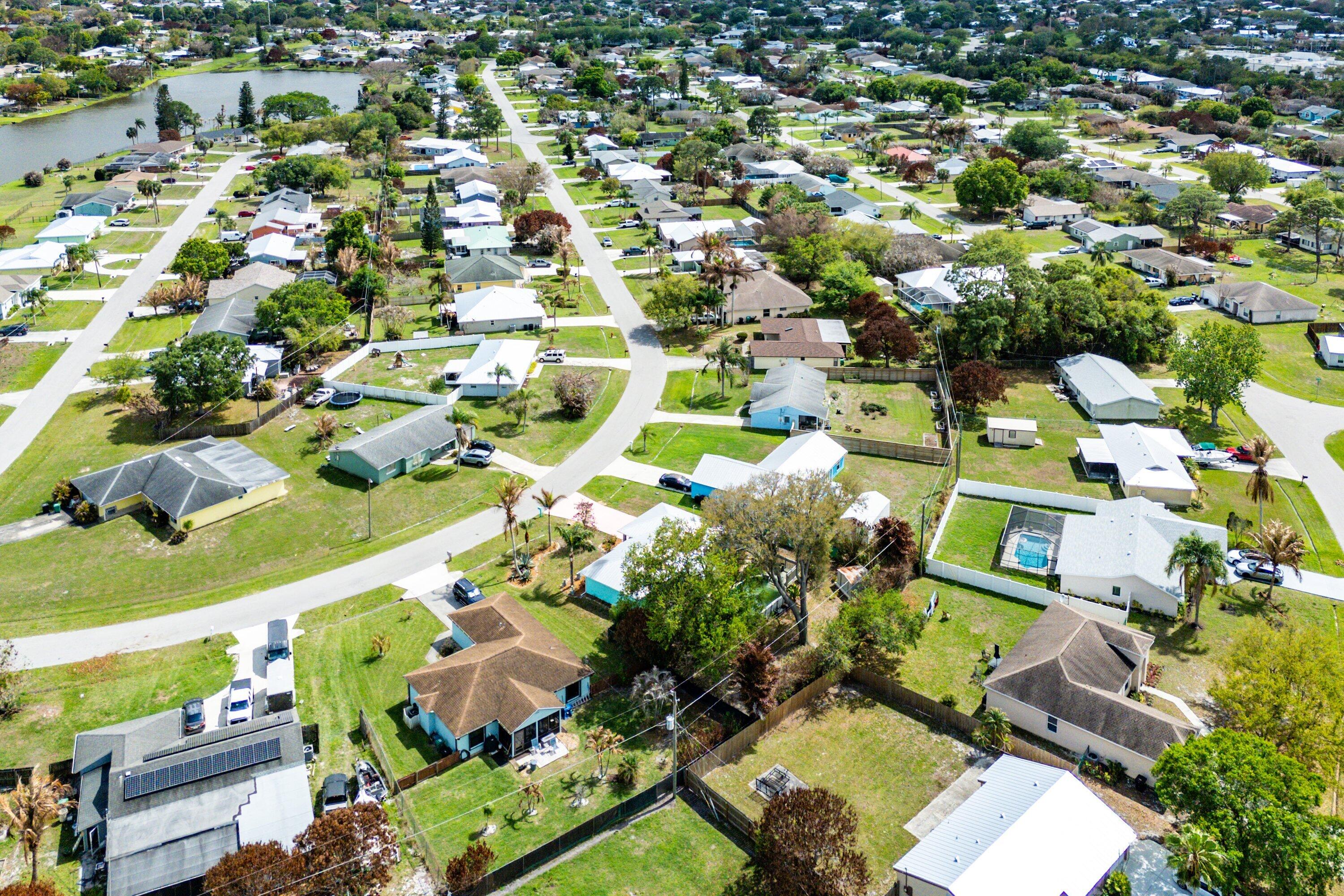 2114 Southeast Midtown Road Port St. Lucie, FL 34952 - Photo 30 of 41 an aerial view of residential houses with outdoor space