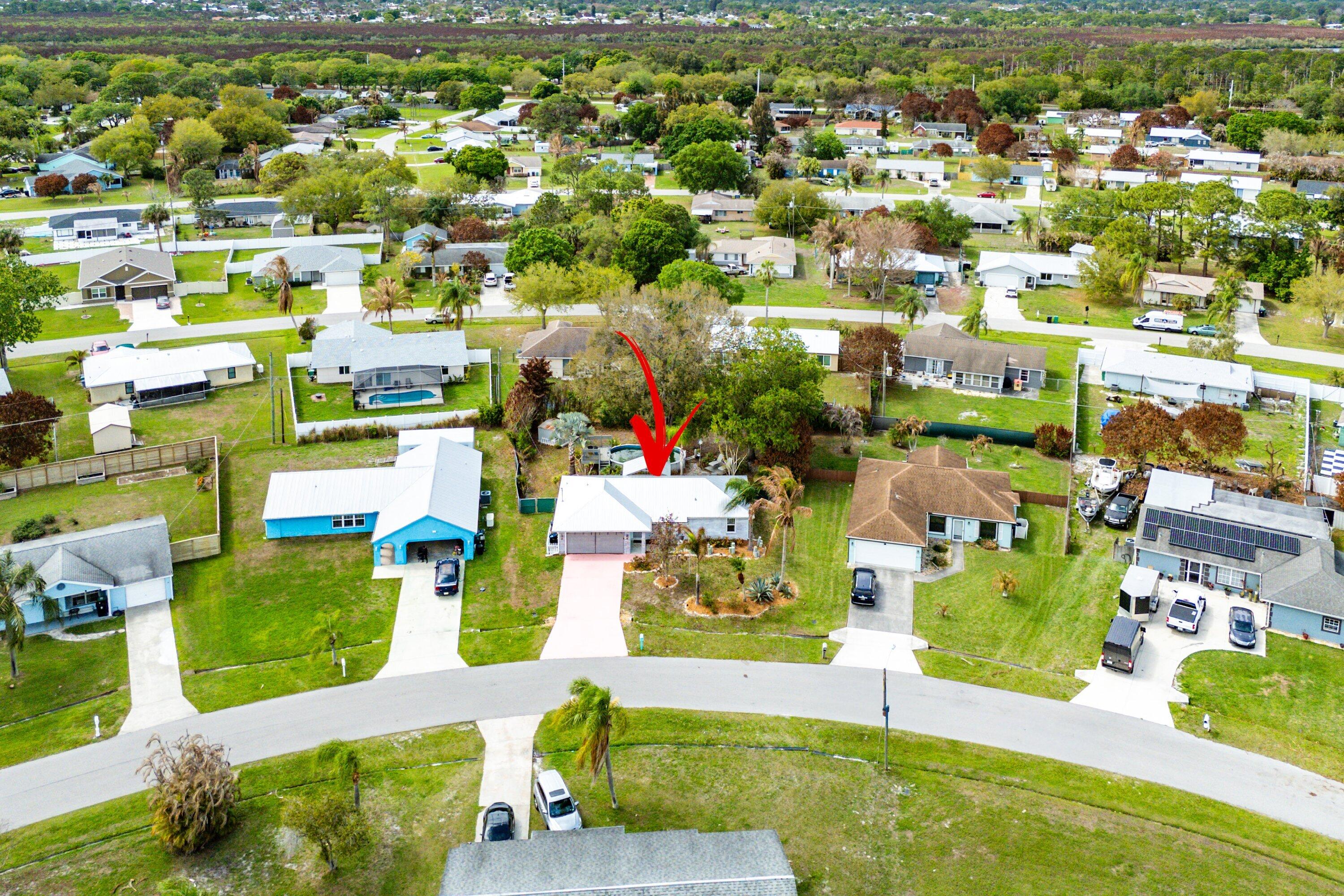 2114 Southeast Midtown Road Port St. Lucie, FL 34952 - Photo 31 of 41 an aerial view of residential houses with outdoor space
