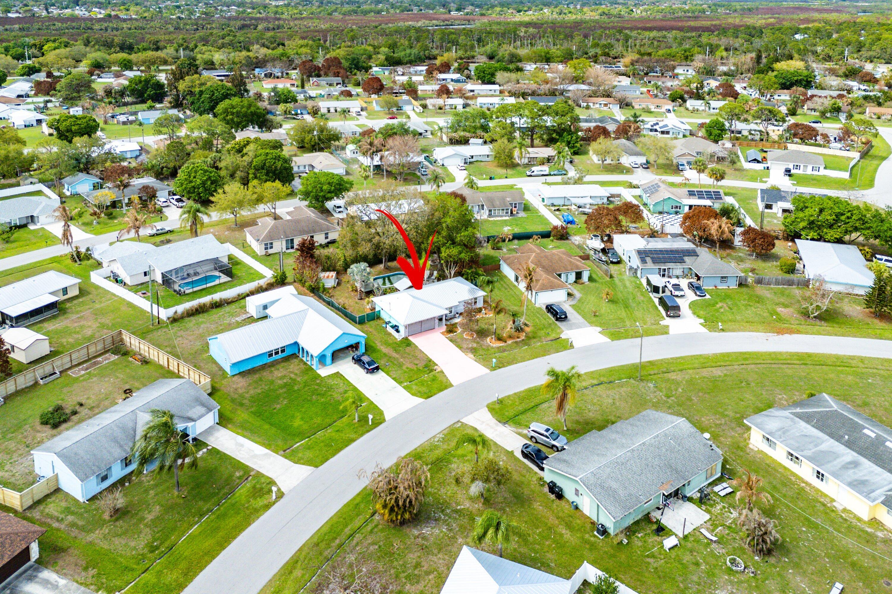 2114 Southeast Midtown Road Port St. Lucie, FL 34952 - Photo 33 of 41 an aerial view of residential houses with outdoor space